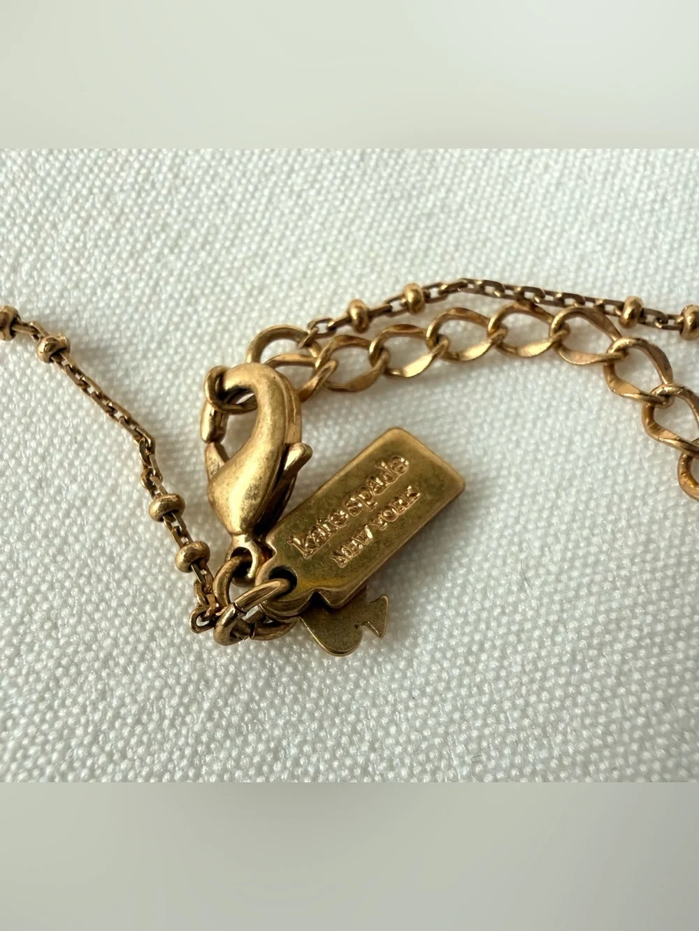 Kate Spade Gold Tone Imitation Pearl Charm Necklace